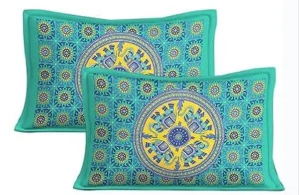 Matching pillow covers of the green Double bed bedsheet with a detailed Jaipuri print.