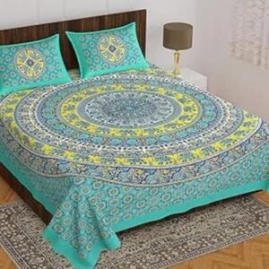 Right-angle view of the green Double bed bedsheet showing half the bedsheet and two pillow covers with Jaipuri print.
