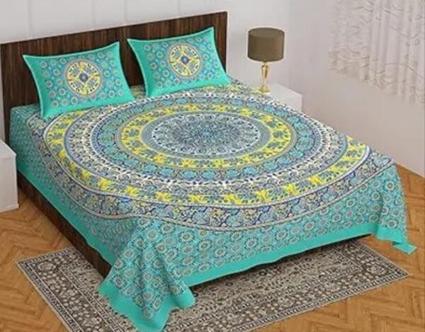 Right-angle view of the green Double bed bedsheet showing half the bedsheet and two pillow covers with Jaipuri print.