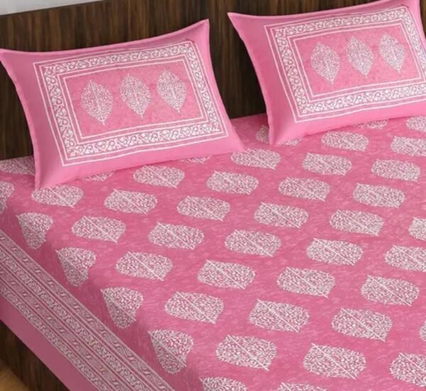 Half view of the Double Bed Bedsheet and Pillow Cover Set showing detailed patterns and soft pink tones.