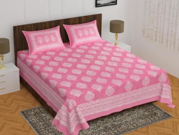 Double Bed Bedsheet and Pillow Cover Set in pink, featuring intricate printed patterns for elegant bedroom decor.