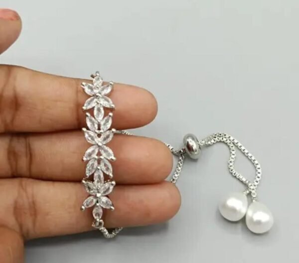 Radiant Shimmer Silver Plated American Diamond and Pearl Bracelet with luxurious silver plating, dazzling diamonds, and lustrous pearl accents.