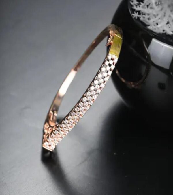 Rose Gold-Plated American Diamond Bracelet displayed against a black background, emphasizing the brilliance of the rose gold plating and dazzling stones.
