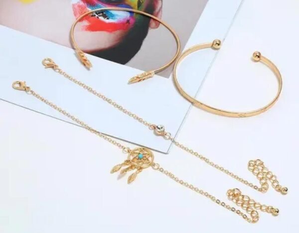 Top view of the gold-plated bracelet set, presenting the adjustable bands and unique patterns in detail.