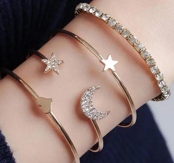 Main image showcasing a set of 4 rose gold-plated cuff bracelets with moon, star, and heart designs, adorned with cubic zirconia.
