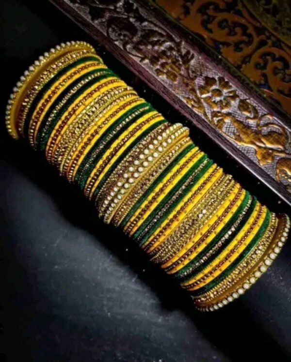 Main image showcasing the Elegant Yellow and Dark Green Chuda, wrapped in vibrant silk thread and adorned with sparkling white stones.