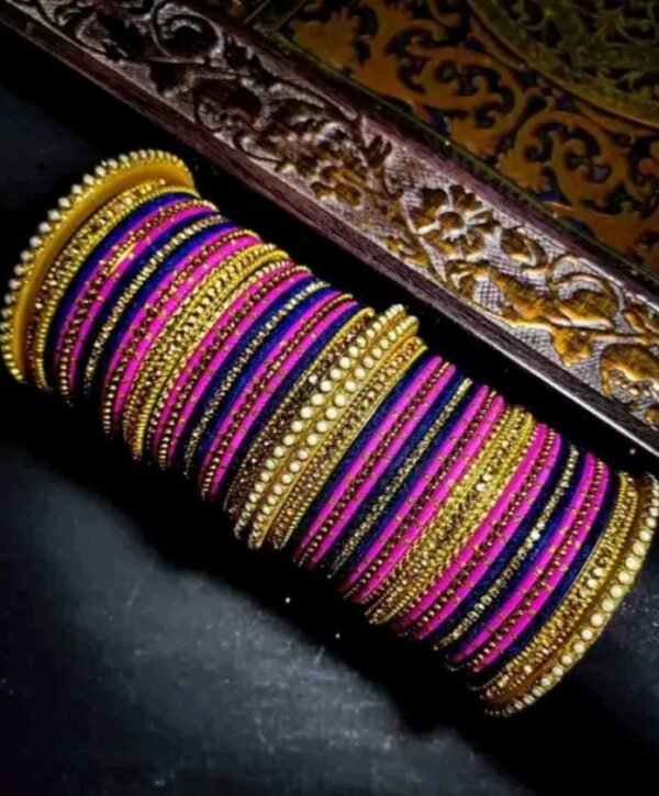 Main image showcasing the Elegant Pink and Purple Chuda, wrapped in vibrant silk thread and adorned with sparkling white stones.