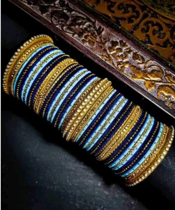 Main image showcasing the Elegant Light Blue and Dark Blue Chuda, wrapped in vibrant silk thread and adorned with sparkling white stones.