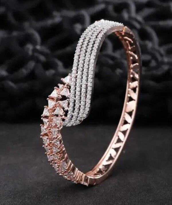 Blushing Brilliance Rose Gold Plated Bracelet displayed on a black background, emphasizing the brilliance of the rose gold and sparkling stones.