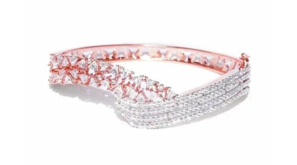 Close-up view of the Blushing Brilliance Rose Gold Plated American Diamond Bracelet on a white background, showcasing its intricate design and sparkling details.