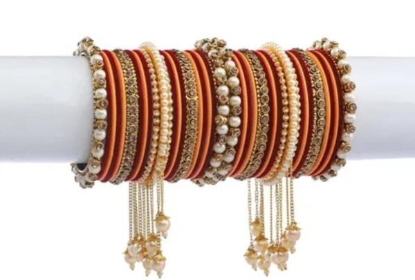 Main image showcasing the Maroon & Peach Gold-Plated Pearl Studded Kada with Velvet Bangles, featuring elegant craftsmanship with pearls and rich maroon and peach hues.