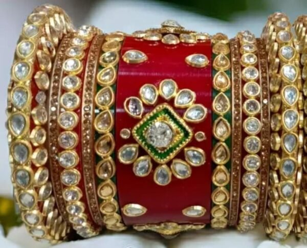 Closeup view of the kundan stones on the Red Rajwadi Chuda, showcasing their intricate design and opulent craftsmanship.