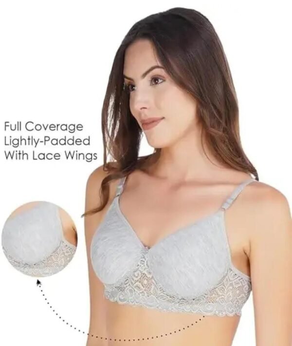A model wearing the T-Shirt Bra in Grey, showcasing its seamless construction, full coverage, and lightly padded cups for a flattering silhouette.