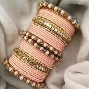 Main image showcasing the Peach Kundan Stone and Pearls Bangles Set, featuring intricate kundan and pearl work on a durable metal base, perfect for ethnic wear and special occasions.